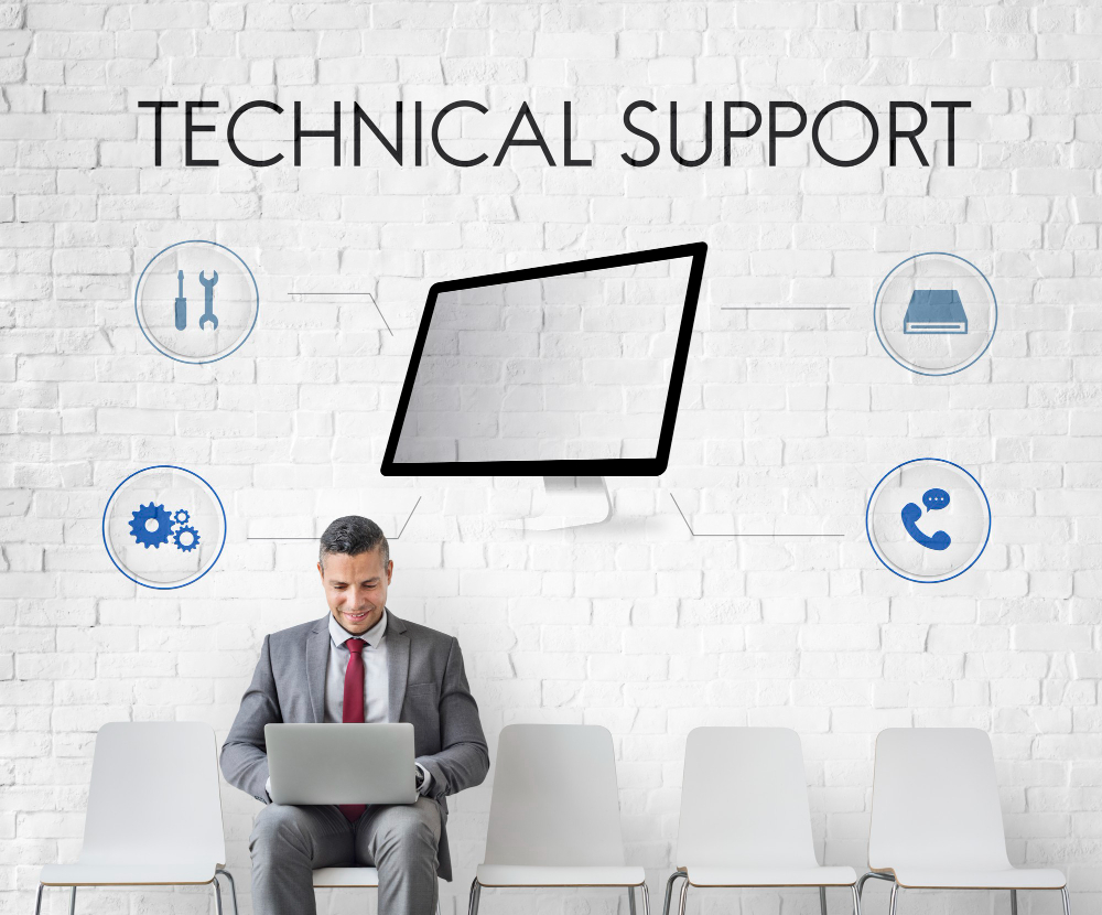 A man in a suit sits with a laptop, surrounded by icons representing technical support services for law firms.